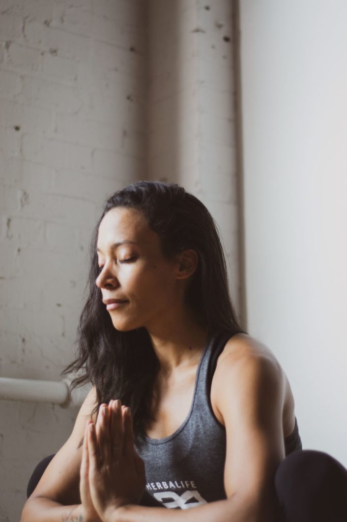 Woman using meditation to help deal with the stress of divorce.